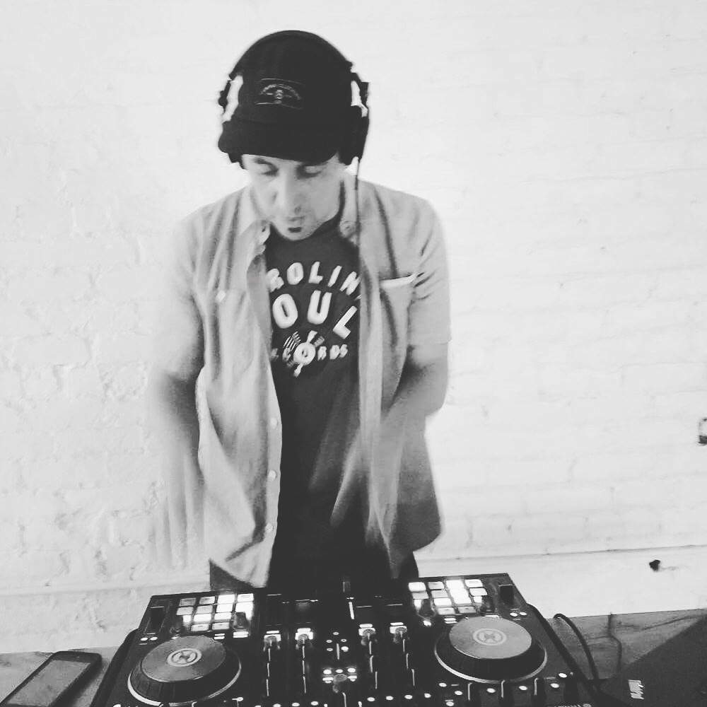 This image has an empty alt attribute; its file name is dj-rhymic.jpg